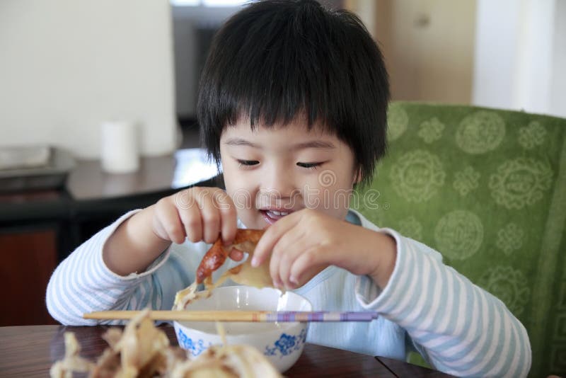 Little cute asian girl eating