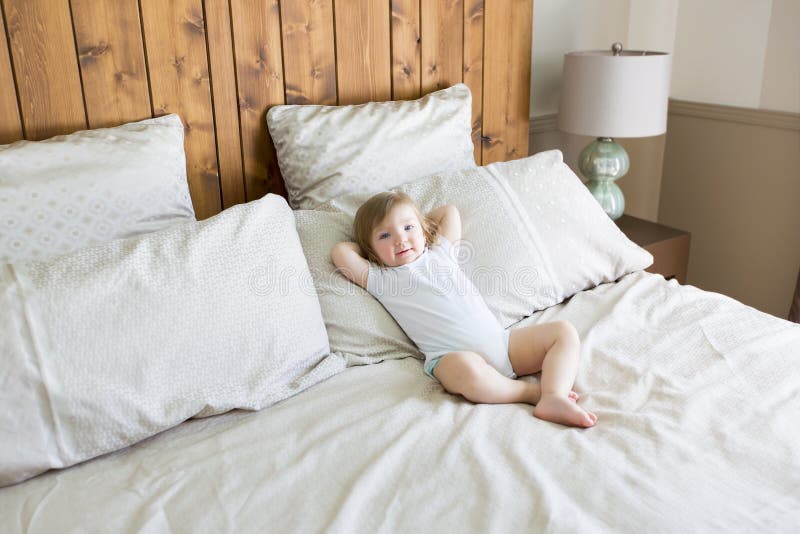Little Cute Baby Girl on the Bed Stock Image Image of bedroom, people