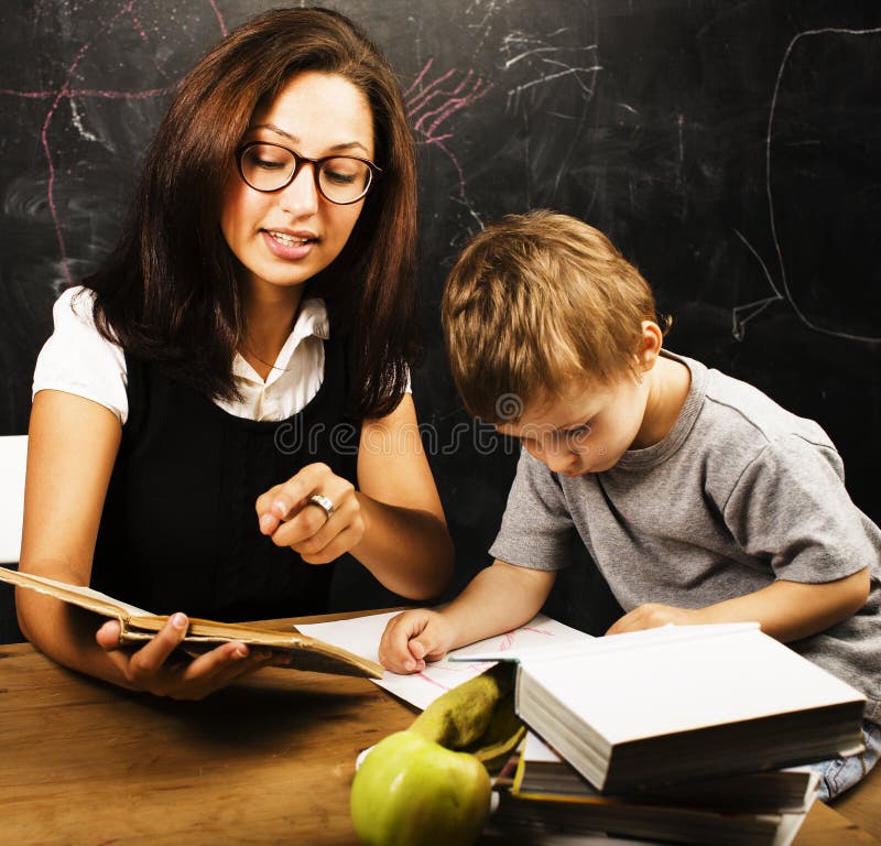 Little cute boy with teacher in classroom royalty free stock photo Little cute boy with teacher in classroom royalty free stock photo