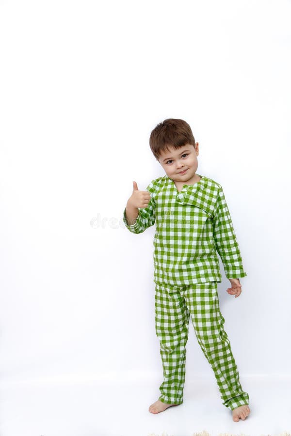 Little Cute Caucasian Boy in Green Pajamas Posing and Showing Emotions ...