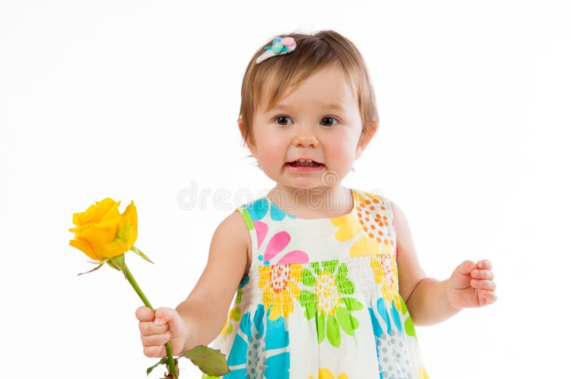 Little cute girl with beautiful yellow rose, romantic gift