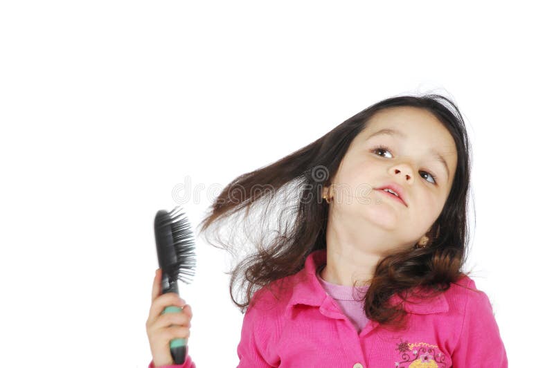 Little cute girl brush the hair