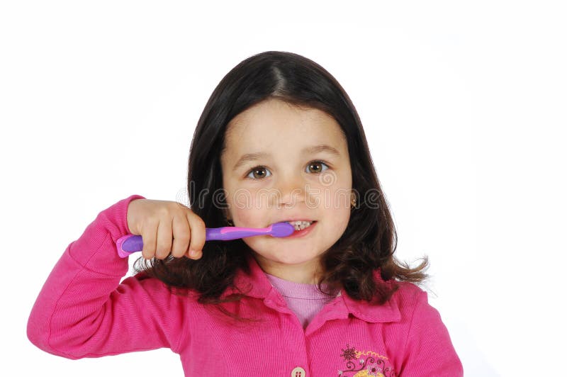 Little cute girl brushing the teeth