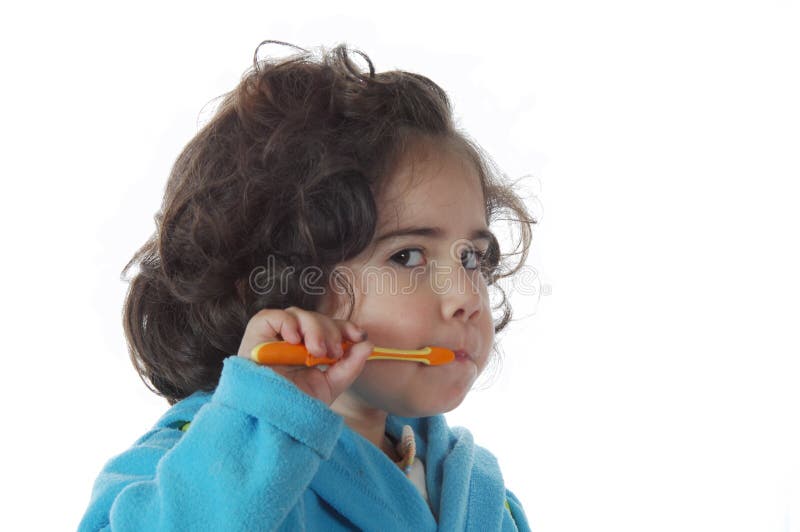 Little cute girl brushing the teeth