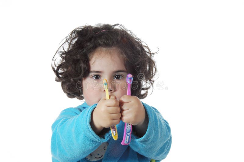 Little cute girl brushing the teeth