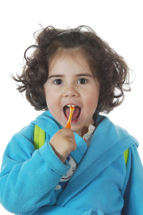 Little cute girl brushing the teeth