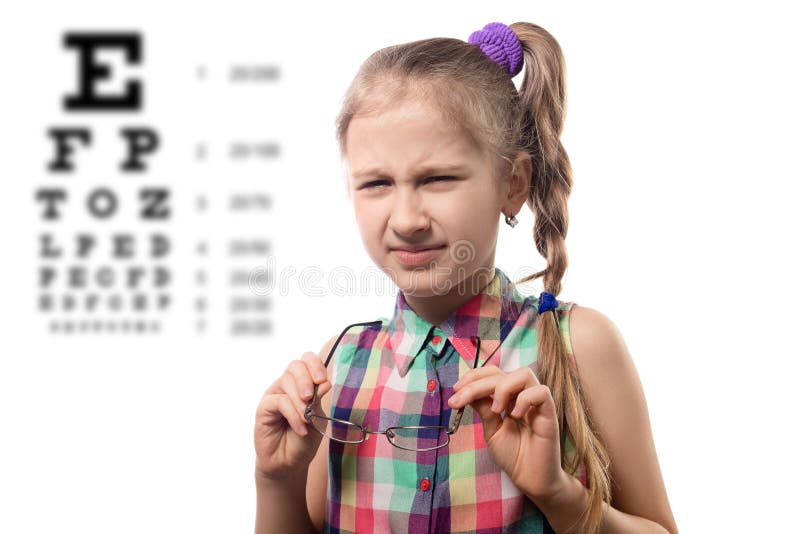 Little cute girl in glasses posing on a white background