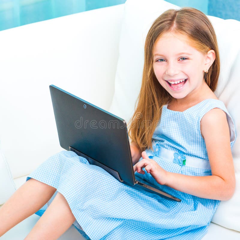 Little cute girl with a laptop