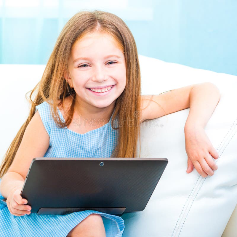 Little cute girl with a laptop