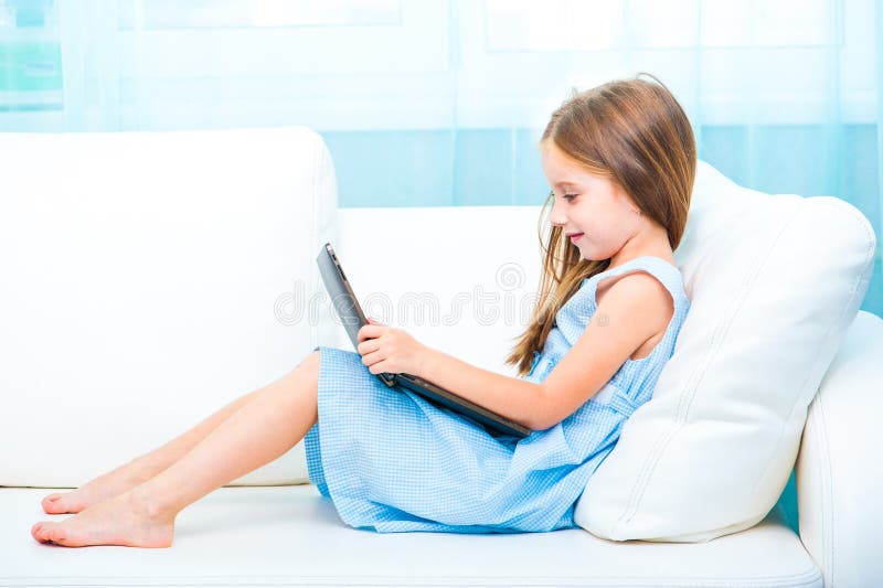Little cute girl with a laptop