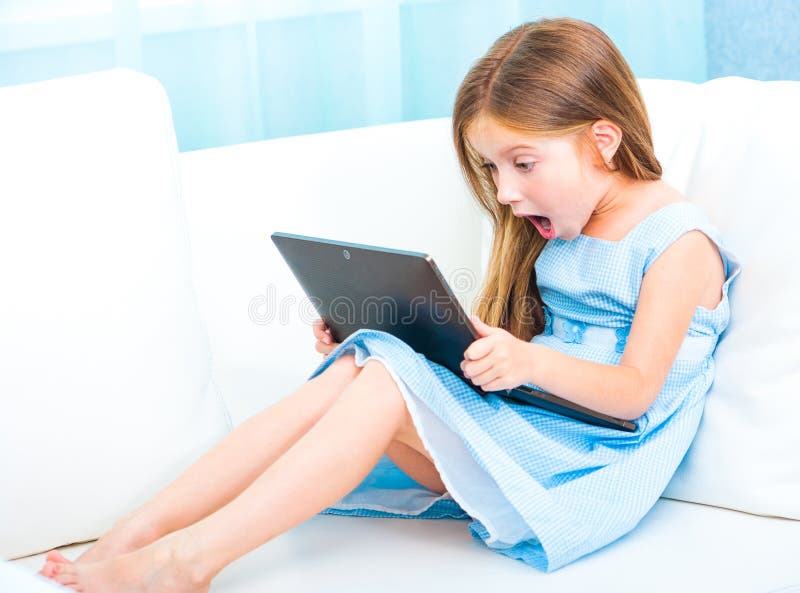 Little cute girl with a laptop