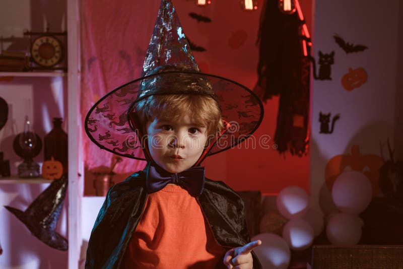 Little Cute Halloween Wizard. Magic Hat. Children Play with Pumpkins ...