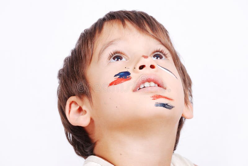 Little cute kid with colors on his face