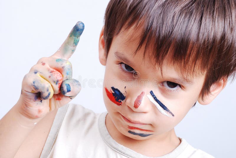 Little cute kid with colors on his face