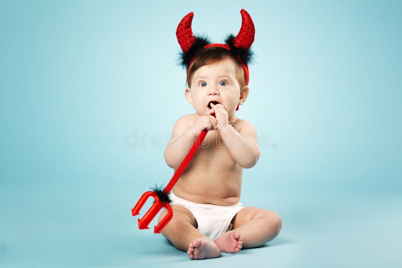 Little funny baby with devil horns and trident