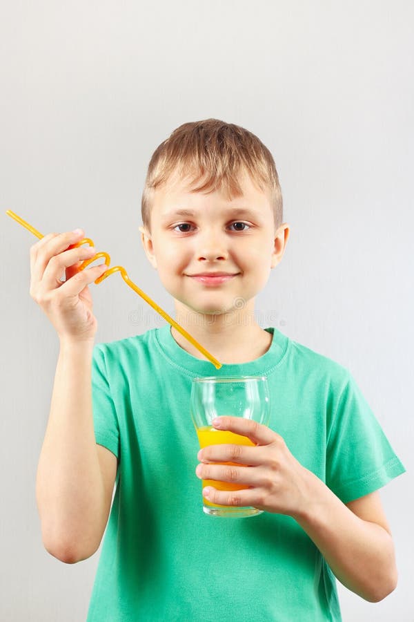 Little Funny Boy is Going To Drink Fresh Orange Juice through a Straw ...