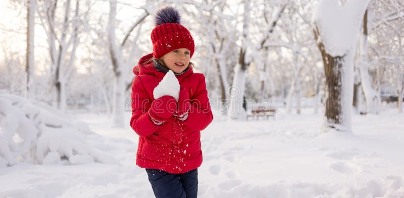 A Little Girl Alone in Mittens, a Red Jacket and a Knitted Hat in ...