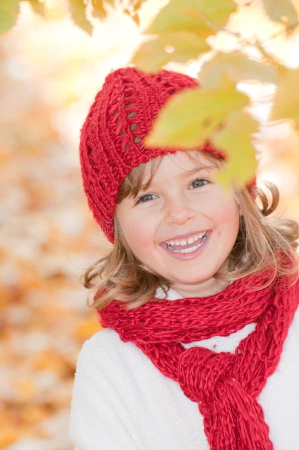 Little girl in autumn park