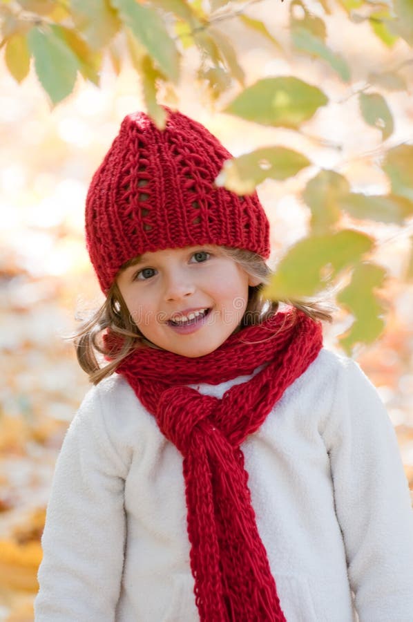 Little girl in autumn park