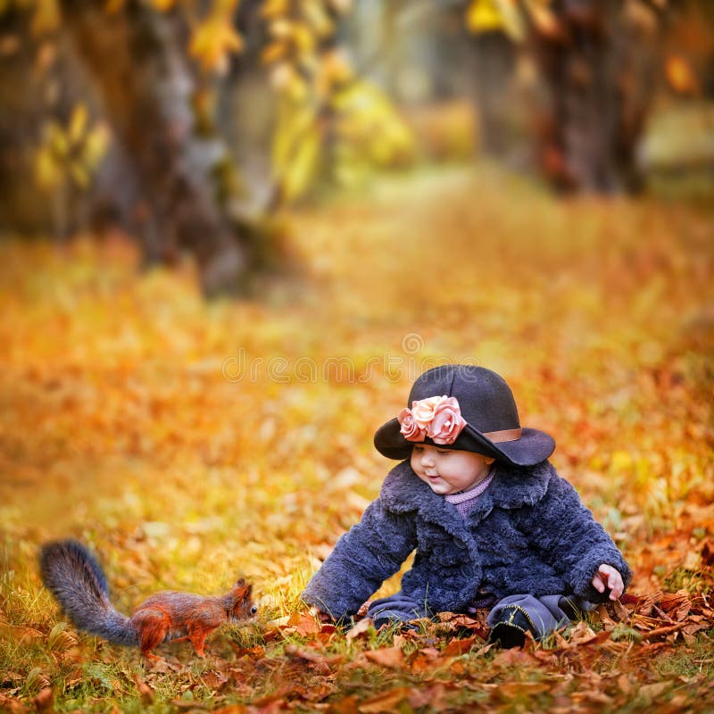 Little girl in autumn park