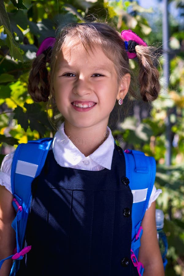 Little Girl with Backpack in the Vineyard in the Summer Stock Image