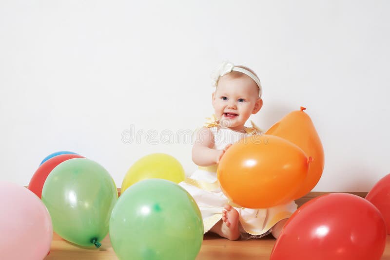 Little girl in balloons