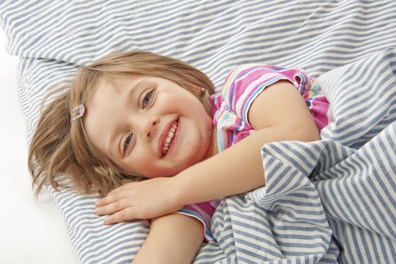 Little girl in the bed stock image. Image of beauty, baby 21878693