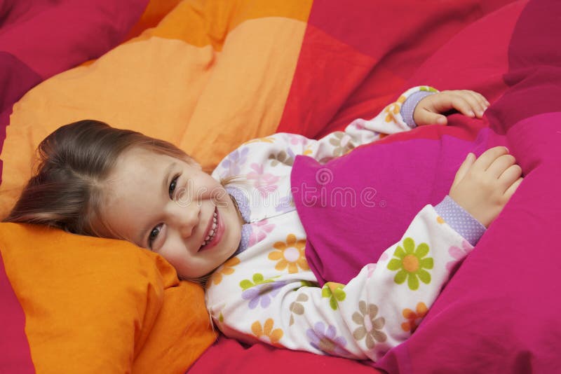 Little Girl on a Bed stock image. Image of daughter, care 24083733