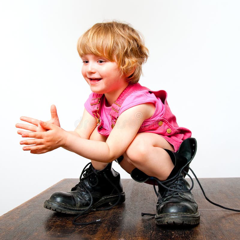 Little girl in big boots stock photo. Image of little 13752868