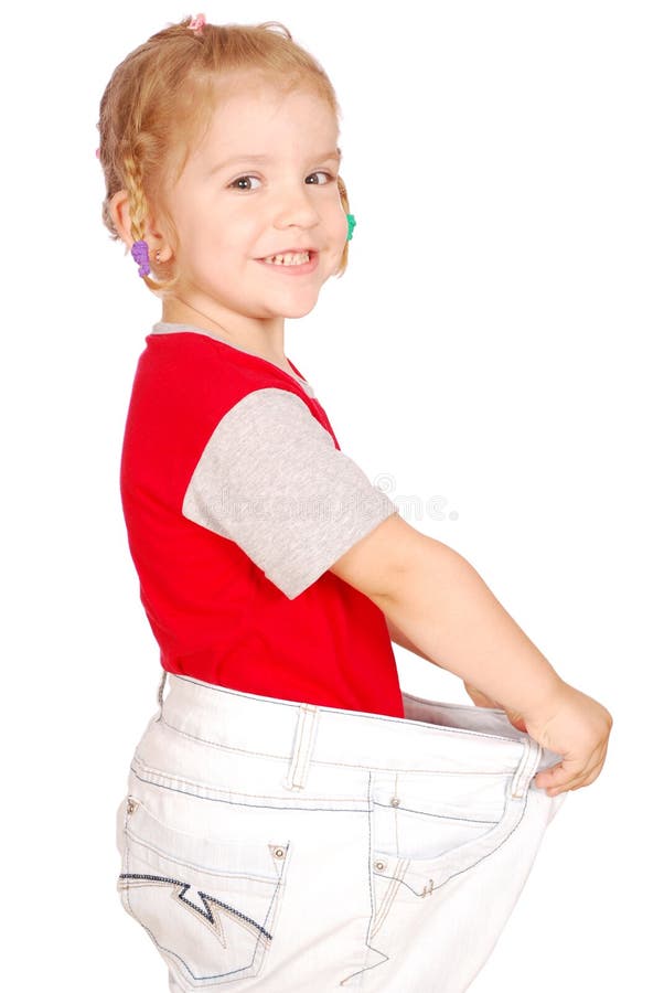 Little girl in big pants stock photo. Image of studio 15353726