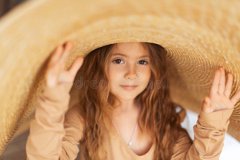 Little Girl in a Big Straw Hat Stock Photo Image of hair, yellow