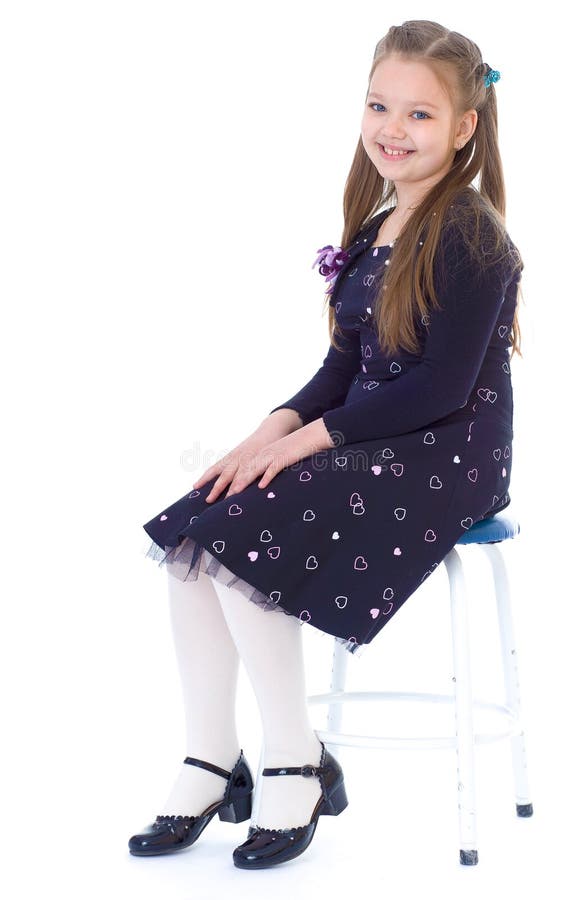 Little girl in a black dress stock photos Little girl in a black dress stock photos