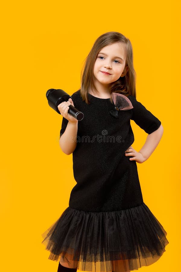 Little Girl in Black Dress with Microphone Stock Image Image of