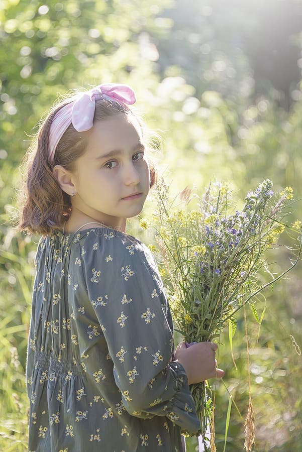 Little Girl with a Bouquet of Wild Flowers, Portrait Stock Image ...