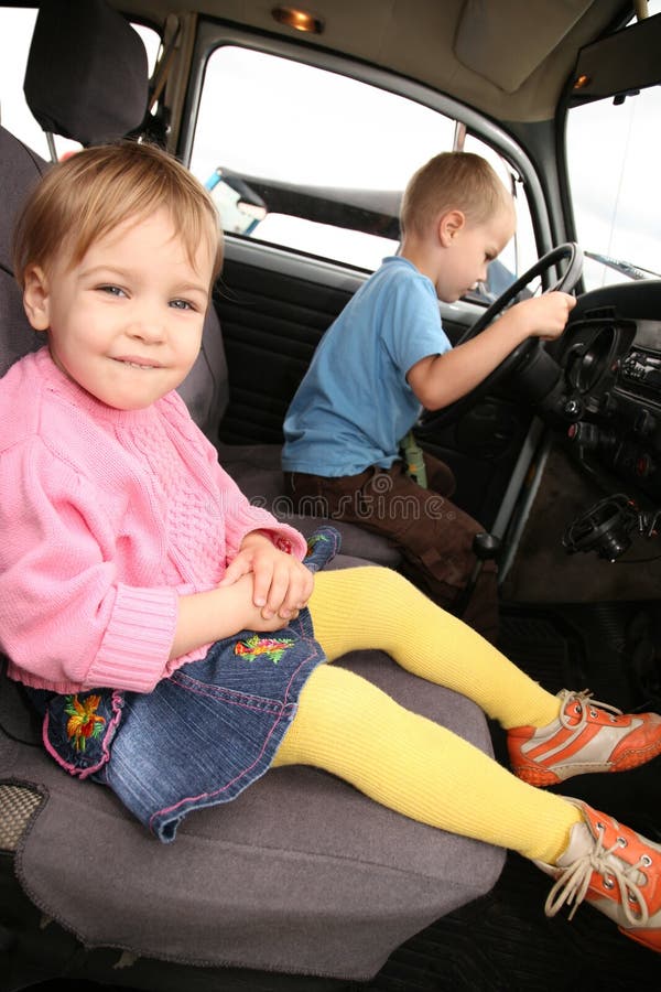 Little Girl and boy in car stock image. Image of female 7092003