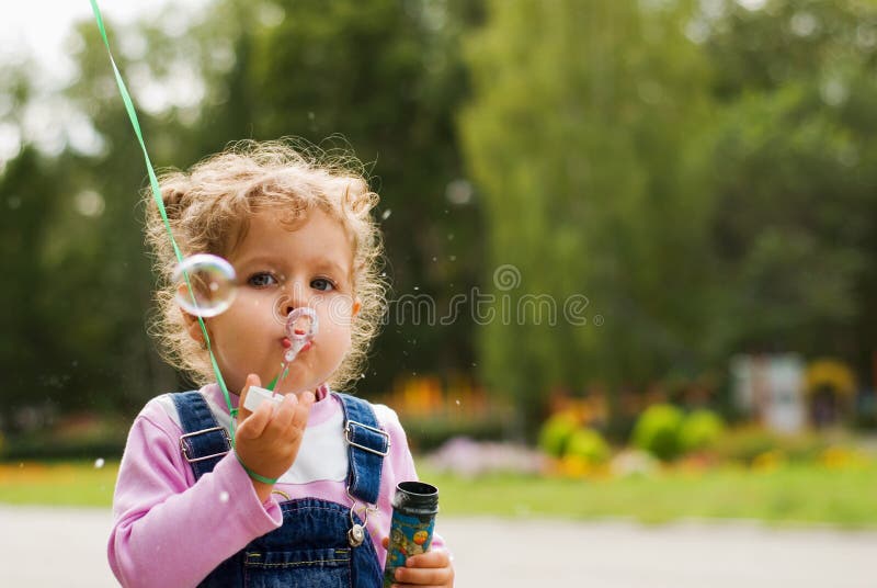 Little girl and the bubbles