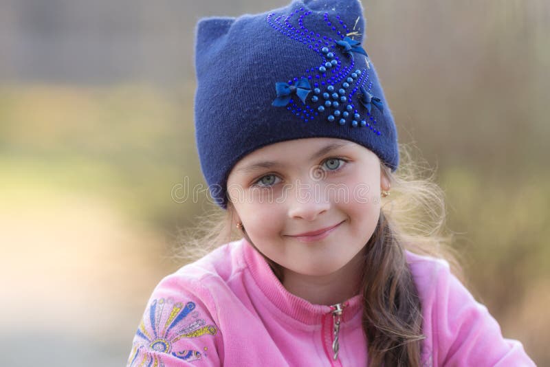 Little Girl in a Cap Closeup Stock Photo - Image of smile, female ...