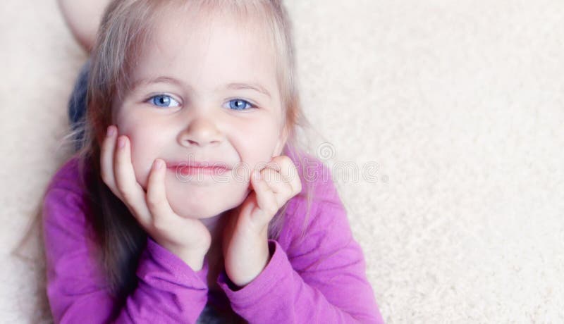 Little girl on a carpet