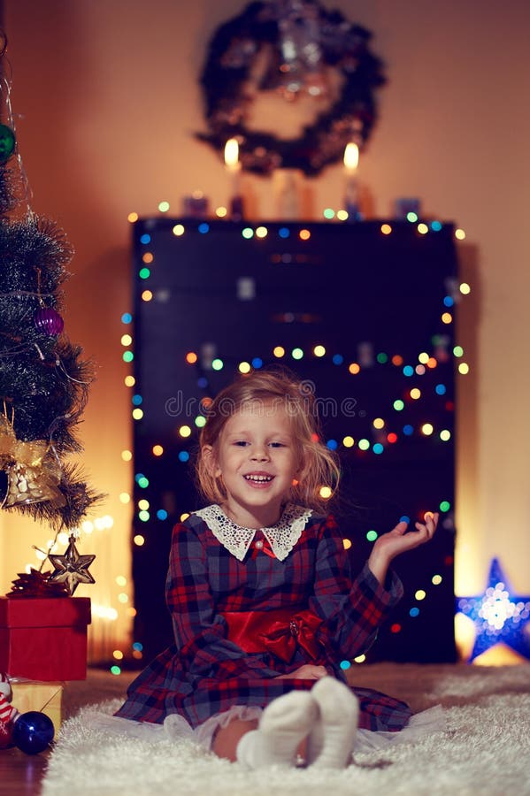 Little Girl Celebrating Christmas Stock Photo - Image of magic, dress ...