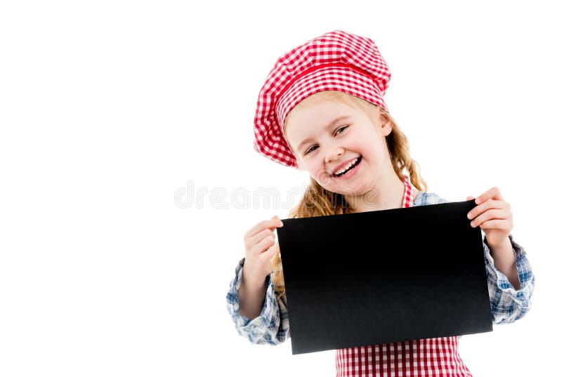 Little girl in chef uniform with blank paper stock photos Little girl in chef uniform with blank paper stock photos