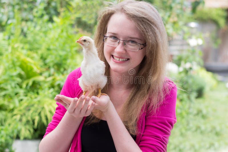 Little girl with chicken stock image. Image of newborn 41920869