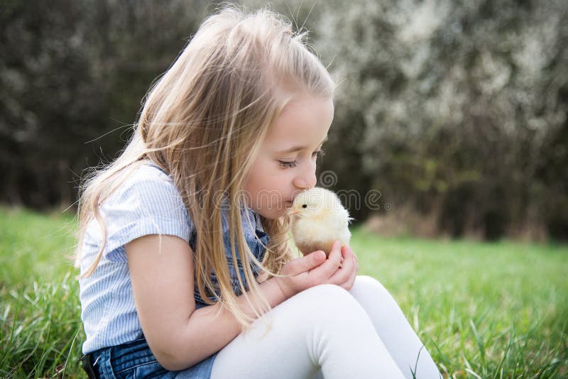 Little girl with chicken. 