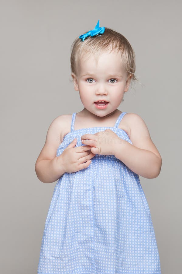 Little Girl Child in Blue Dress with Short Hair and Bow. Happy Childhood. Stock Photo - Image of lesson, childhood: 187384492 Little Girl Child in Blue Dress with Short Hair and Bow. Happy Childhood. Stock Photo - Image of lesson, childhood: 187384492
