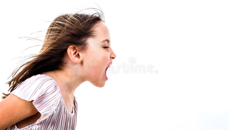 Little girl child yelling, shouting and screaming with bad manners. Angry upset girl is arguing with emotional expression on face. Frontal profile view of children. Isolated on white background