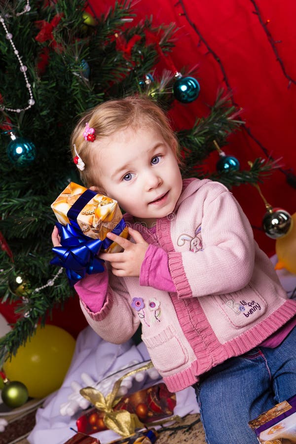 Little Girl with Christmas Presents Stock Image Image of holding, caucasian 27834951