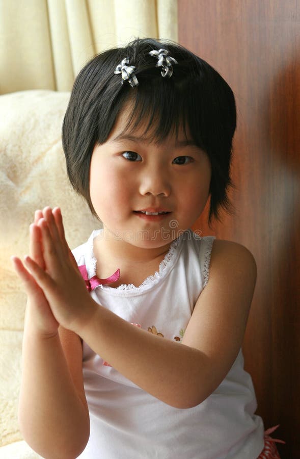 Little girl clapping stock image. Image of smile, china 9374195