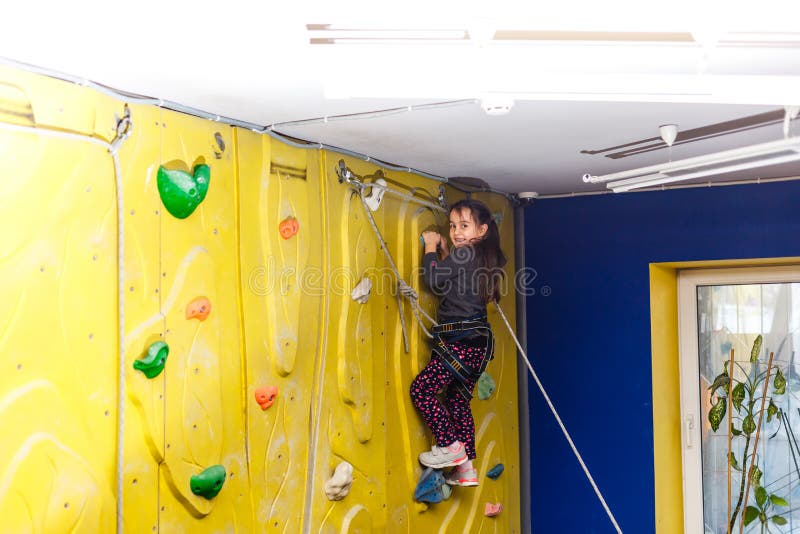 Little Girl Climbing a Rock Wall Indoor. Stock Photo - Image of belay ...