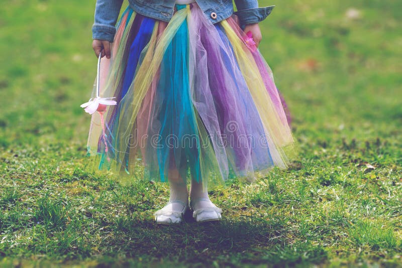 Little girl in colorful tutu skirt