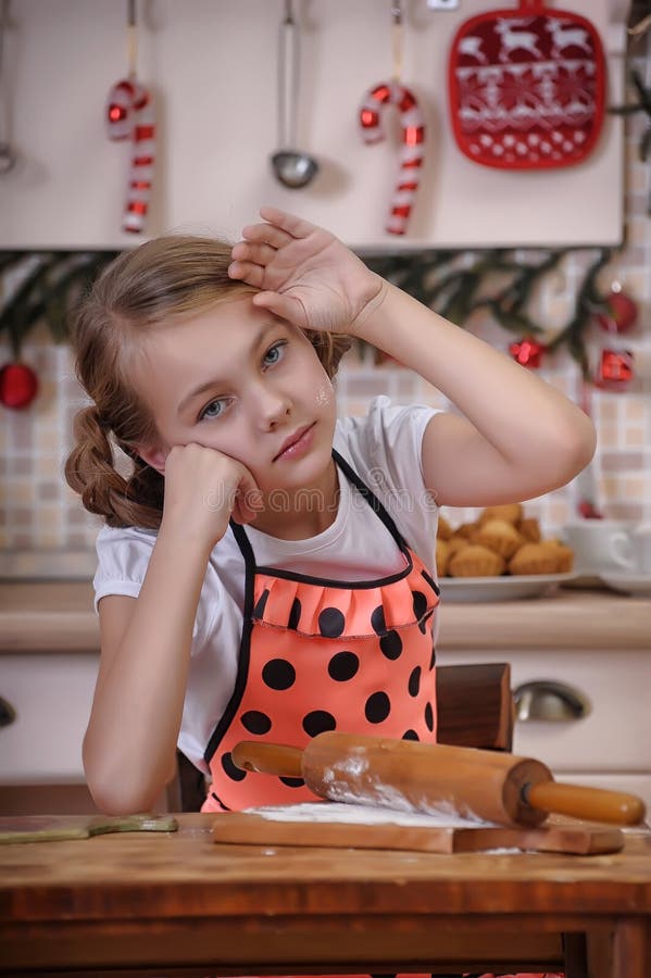 Little girl cooking stock image. Image of bread, apron 29117865