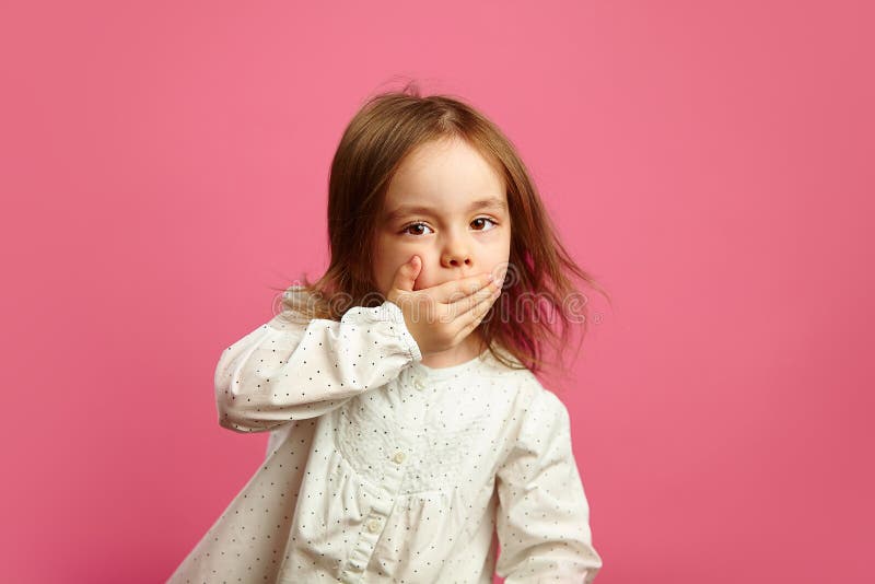 Little Girl Covered Her Mouth. Stock Photo - Image of mouth, child:  116740824